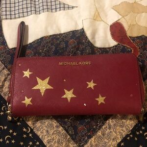 Michael Kors Burgundy Clutch with Gold Stars